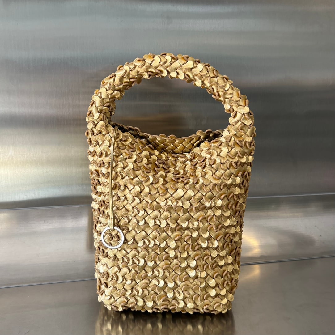 Bottega Veneta Cabat Bucket: The Bottega Veneta Cabat Bucket features a unique three-dimensional design, crafted from individual petals. The meticulous hand-woven petal technique not only elevates the bag's sophistication but als
