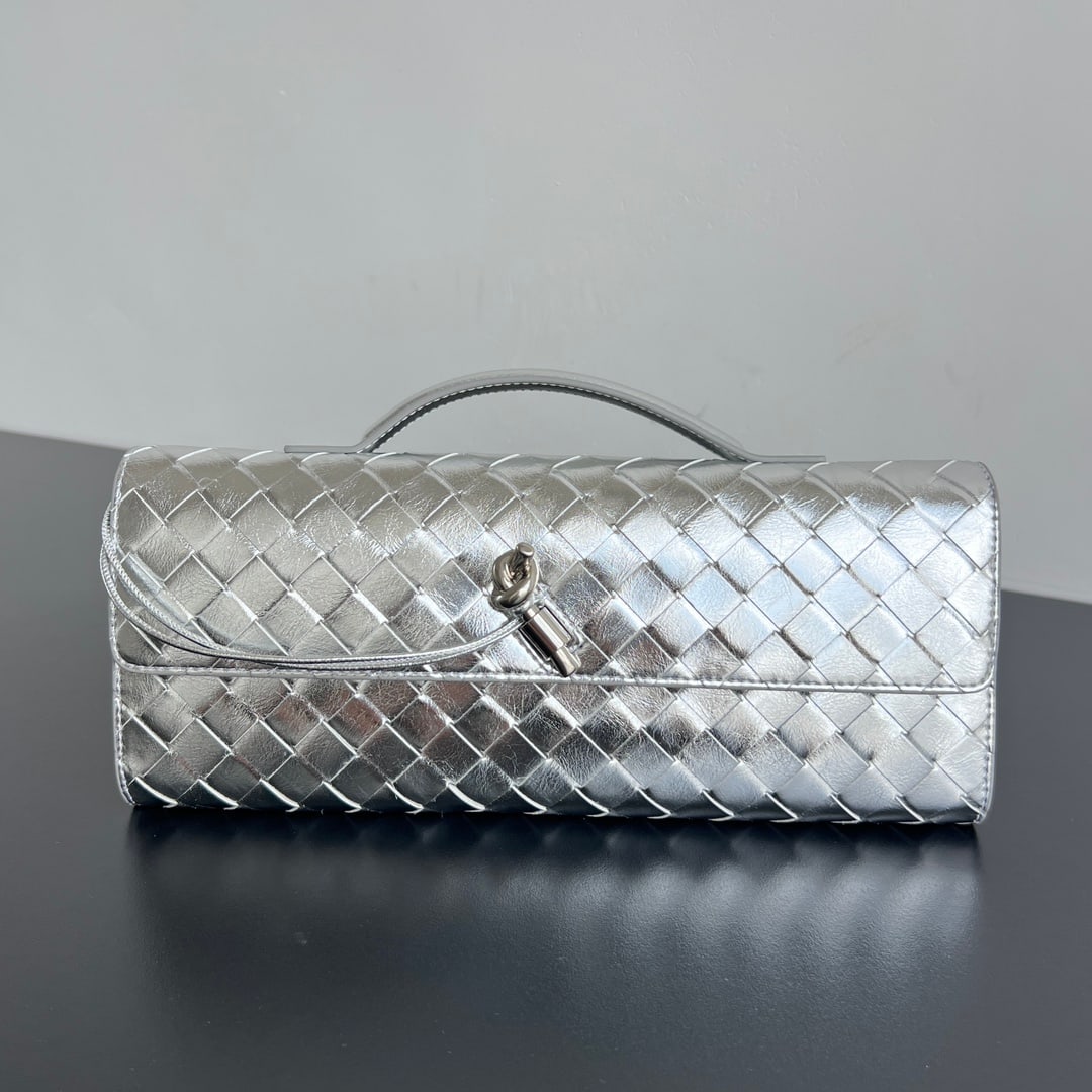 Bottega Veneta Clutch: This Bottega Veneta Clutch is a long handbag with handles. The clutch design embodies refined and sophisticated taste. Made with exquisite intreccio woven lambskin leather, it can be carried by hand, 