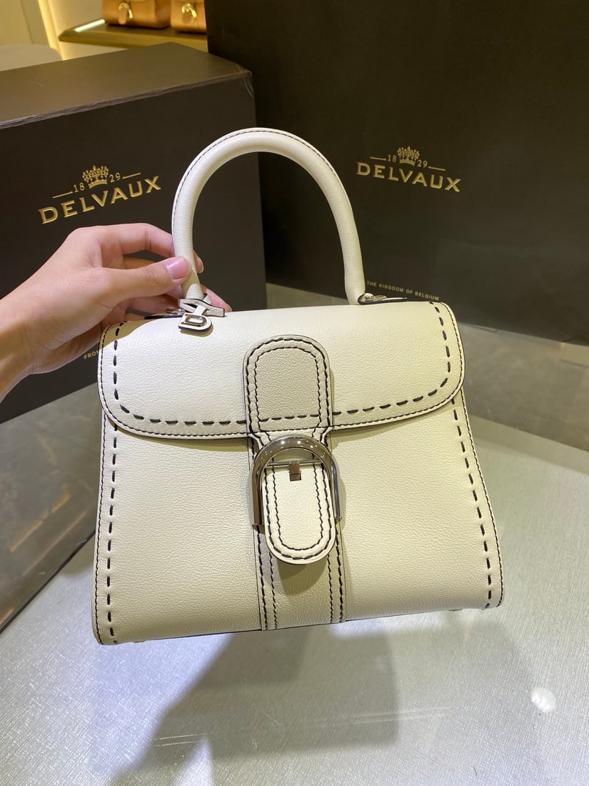 Delvaux: The Delvaux Snow White with Exterior Stitching, part of the Delvaux Spring Summer 2022 collection, is a classic design born in 1958 and a symbol of the Delvaux house. Crafted from Rodeo Calf grained c