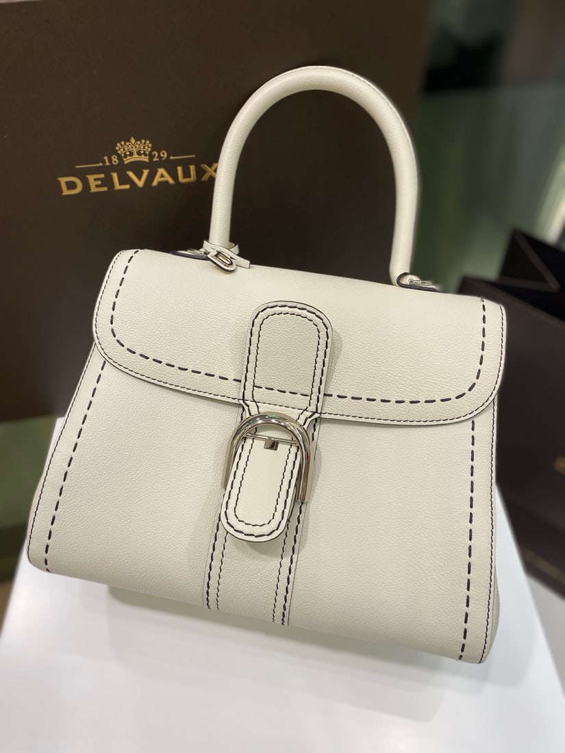 Delvaux brillant: Delvaux brillant, white exterior stitching, a Belgian royal warrant holder, understated luxury, semi-hand-stitched waxed thread finish. Comes with adjustable shoulder strap and mirror. Lambskin lining