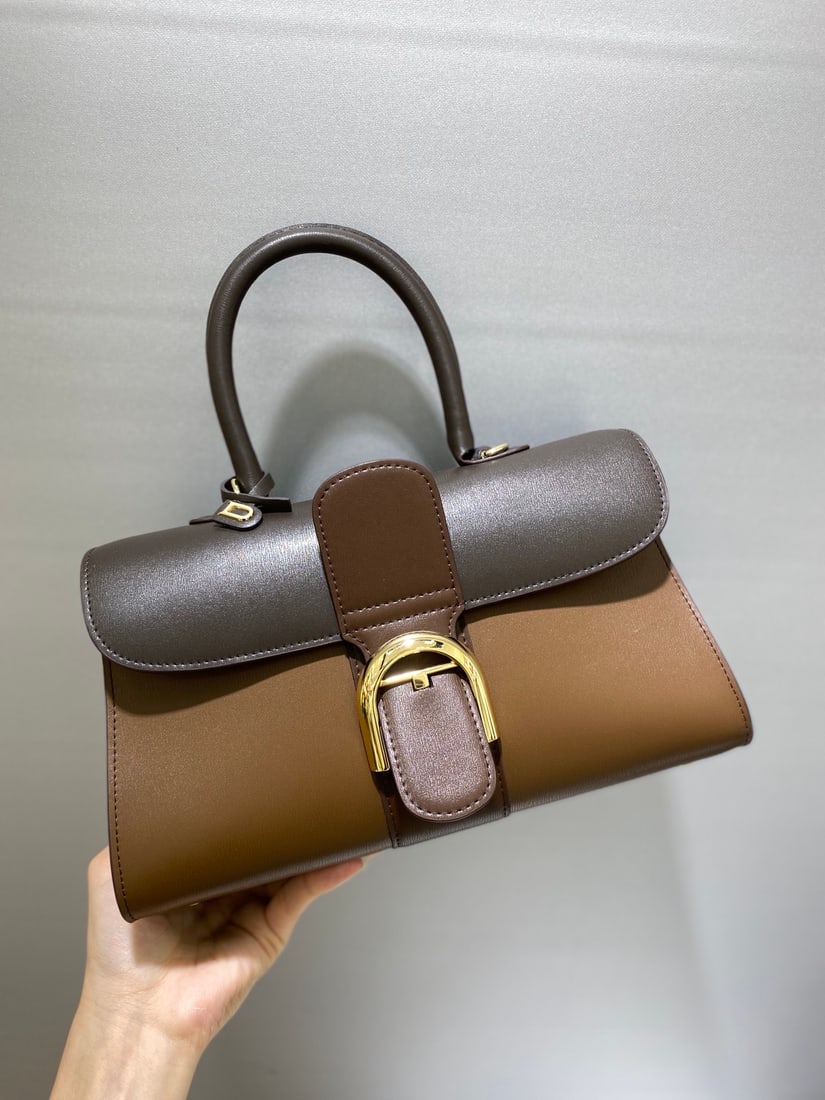 Delvaux brillant: This coffee-flavored trio from Belgian Royal Warrant holder Delvaux brillant features a double-ring brillant box leather interior with lambskin lining, an adjustable long shoulder strap, a mirror, and