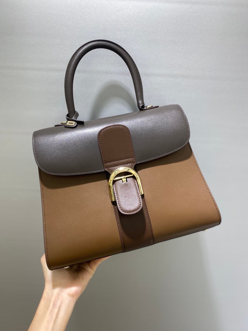 Delvaux brillant: This coffee-flavored trio from Belgian Royal Warrant holder Delvaux brillant features a double-ring brillant box leather interior with lambskin lining, an adjustable long shoulder strap, a mirror, and