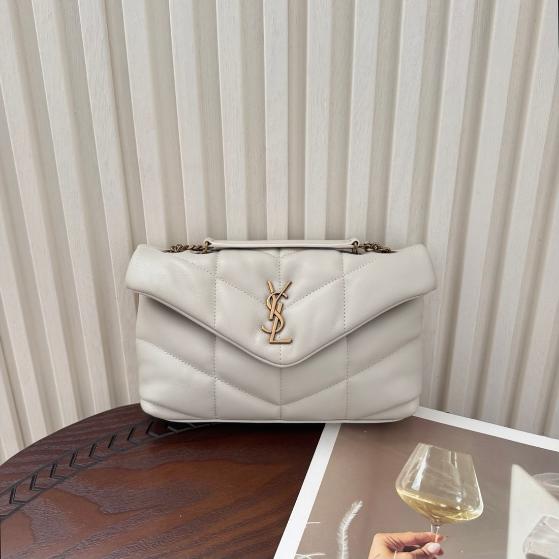 Yves Saint Laurent Louis Puffer Mini Double Chain Terms: LOULOU PUFFER Mini Double Chain Bag! Made with soft, supple lambskin, grosgrain lining, V-quilting, and a sliding chain shoulder strap, it can be worn over the shoulder, as a hobo bag, carried by hand
