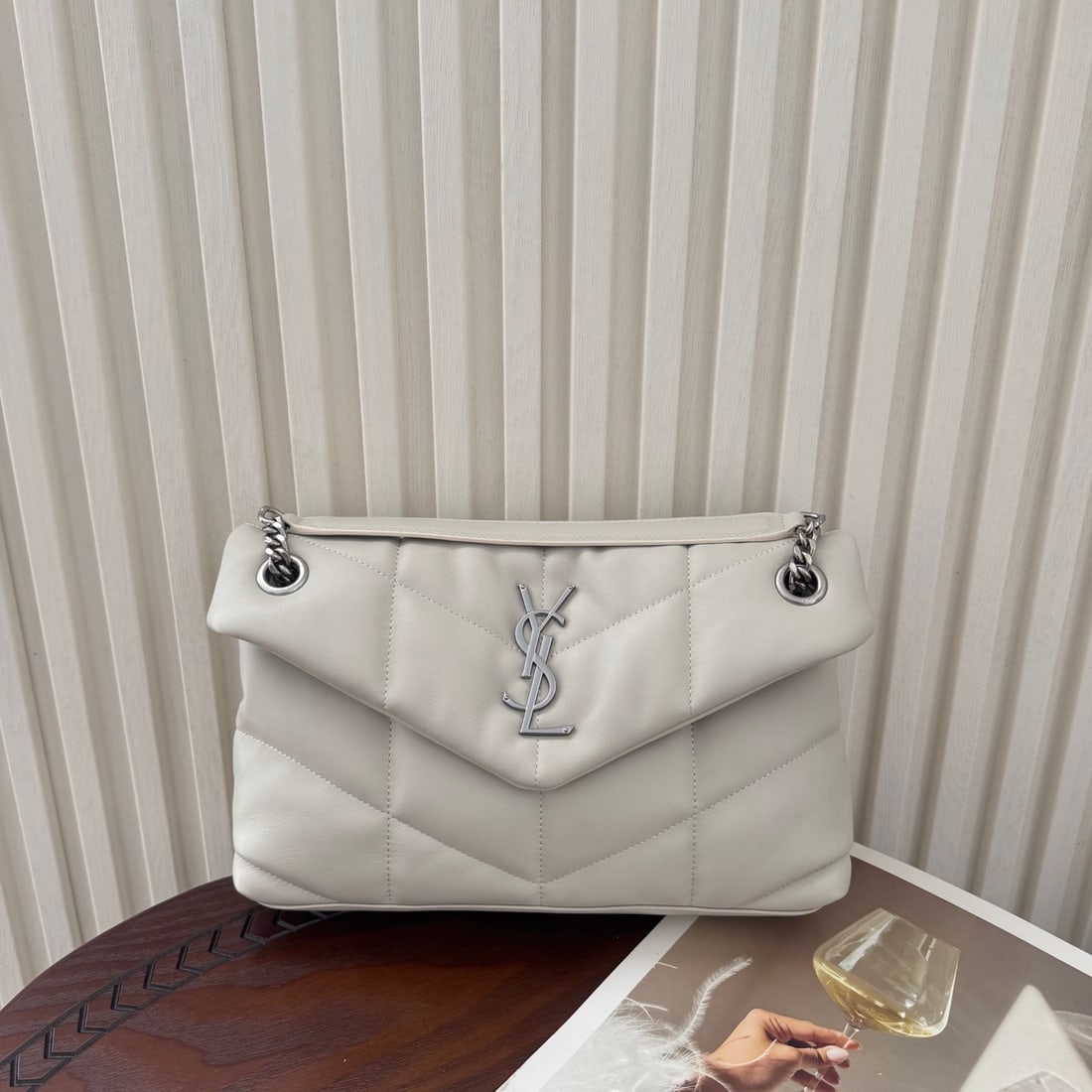 Yves Saint Laurent Louis Puffer Small Quilted Flat Lambskin Bag: LOULOU PUFFER Small Quilted Flat Lambskin Bag, made of soft and delicate lambskin with a grosgrain lining. Spacious and lightweight, it can be worn in multiple ways: shoulder, crossbody, hand-carry, o