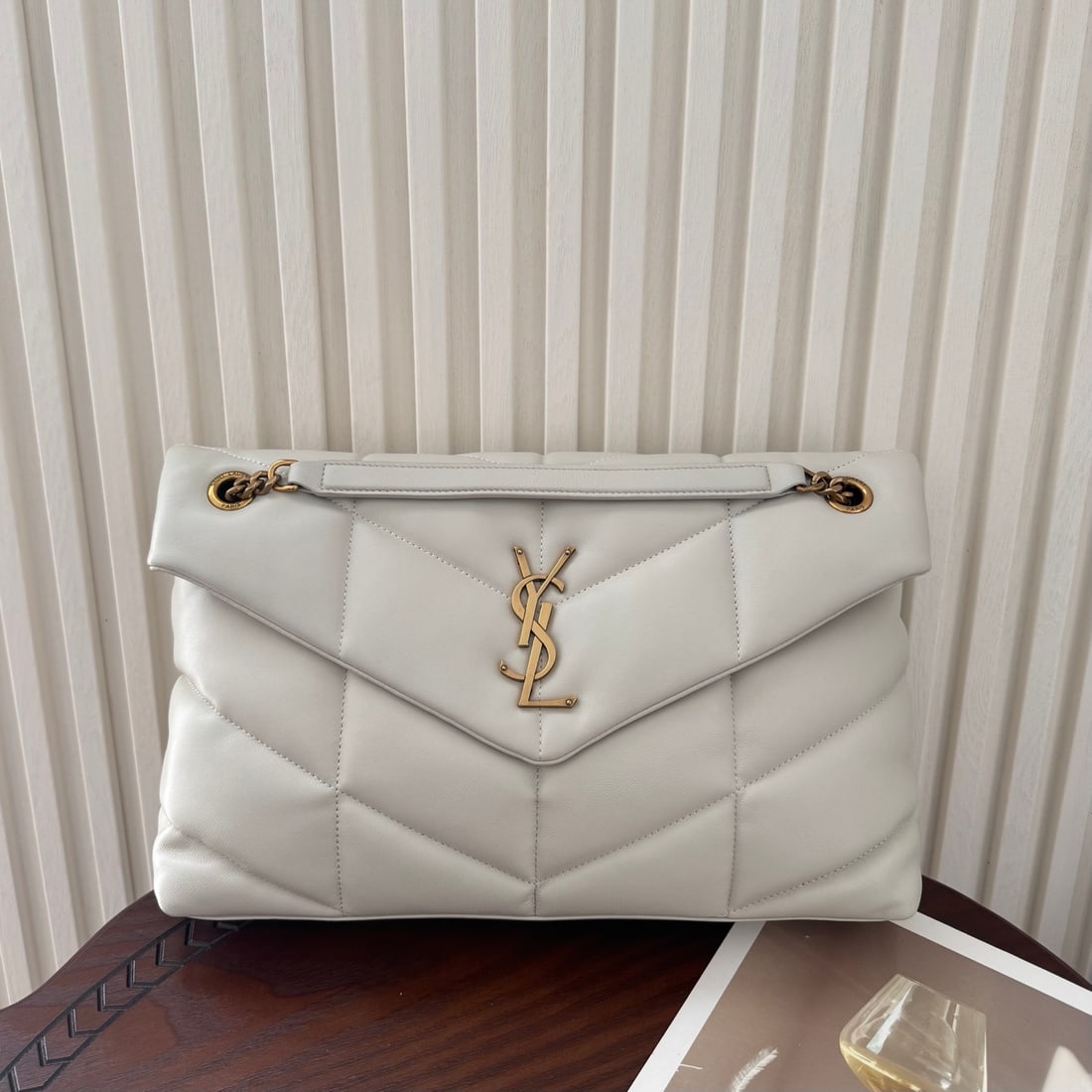 Yves Saint Laurent Louis Puffer Large Quilted Flat Lambskin Bag: LOULOU PUFFER Large Quilted Flat Lambskin Bag: Soft and supple lambskin with a grosgrain lining. Spacious yet lightweight, it can be worn in multiple ways: shoulder, crossbody, hand-carry, or casual s