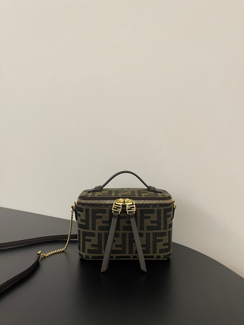 Fendi mini makeup box: This mini makeup box features a classic gold clasp and exudes sophistication. It's stylish whether carried by hand or worn crossbody. It can easily hold a phone, lipstick, and powder compact. Dimensio