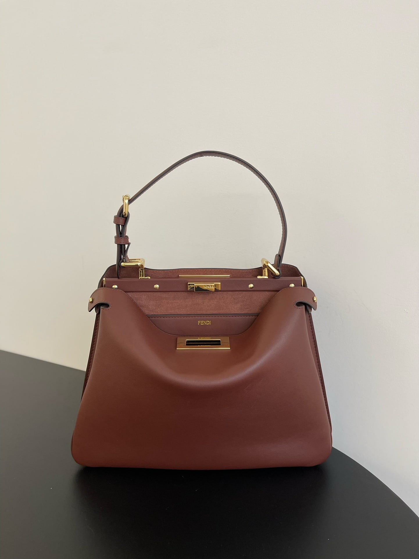 Fendi Peekaboo Soft: Peekaboo Soft, crafted from supple calfskin, features a classic double-sided turn lock for a simple yet sophisticated look. Both side compartments can be opened, offering ample capacity and a stylish 