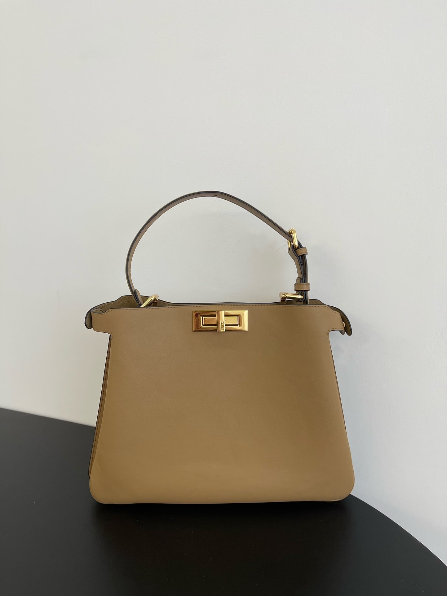 Fendi Peekaboo Soft: Peekaboo Soft, crafted from supple calfskin, features a classic double-sided turn lock for a simple yet sophisticated look. Both side compartments can be opened, offering ample capacity and a stylish 