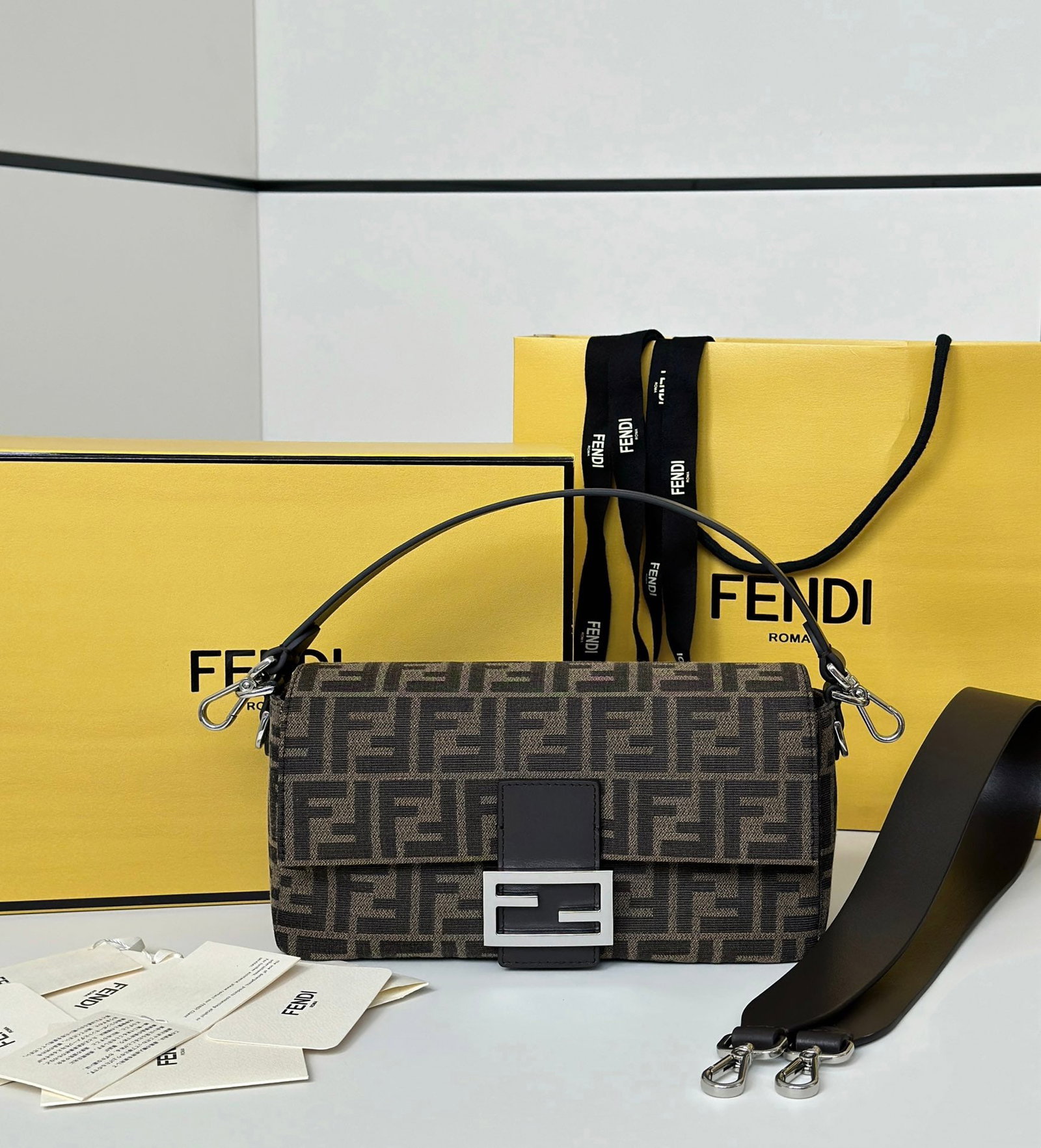 Fendi Baguette: The Baguette bag's rectangular shape, paired with the classic double-F fabric logo and matching dark brown shoulder strap, makes it instantly recognizable. The classic baguette shape gives it a softer