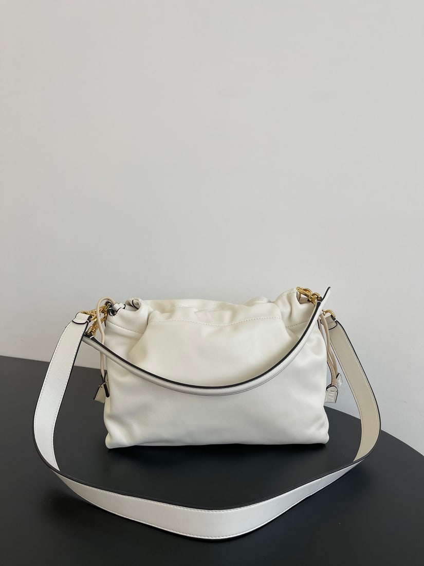 Fendi Mamma Baguette: The large white Mamma Baguette is a combination of a baguette and a lucky bag, arguably the most delicate bag online. The soft, supple lambskin is incredibly smooth and luxurious, exuding both a
