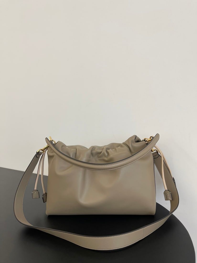 Fendi Mamma Baguette: The large Mamma Baguette in pigeon grey is a combination of a baguette and a lucky bag, arguably the most gentle bag online. The soft, supple lambskin is incredibly delicate, exuding both a relaxed