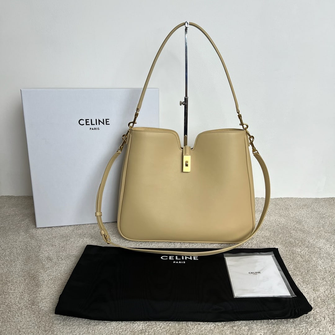 Celine: 16 SOFT Medium, Light Sand Smooth Cowhide Handbag, 36 x 29.5 x 7 cm. This style can hold an iPad and other smart tablets. Cowhide leather, sheepskin lining. Crossbody and shoulder carry with turn-lock