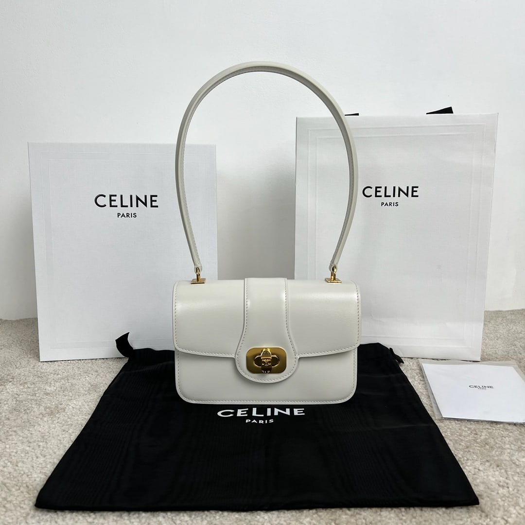 Celine: TEEN JOSEPHINE 18.5 x 13 x 5 cm calfskin leather handbag with sheepskin lining, gold finish, TRIOMPHE embossed twist lock closure, 1 main compartment, 1 interior zip pocket, and leather handles. A won