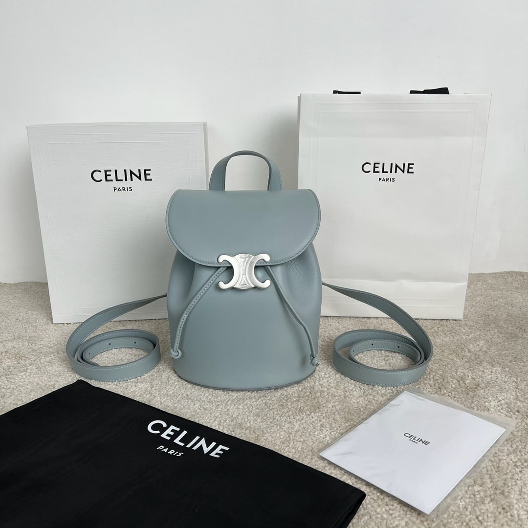 Celine: BONNIE Smooth Cowhide Leather Backpack, Ice Blue, 25 x 18 x 13 cm. Cowhide leather, sheepskin lining, handles, backpack shoulder carry, TRIOMPHE magnetic snap drawstring leather strap, leather handles