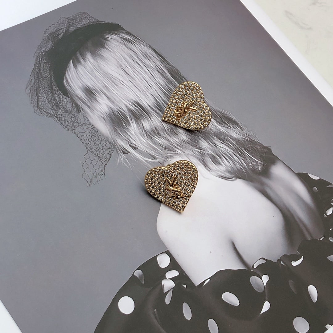 YSL Saint Laurent Heart Earrings: Original YSL Saint Laurent heart-shaped earrings. Founded in 1961, YSL Saint Laurent's elegant, abstract, bold, and unique designs have made it a renowned brand in the luxury fashion world, leading th