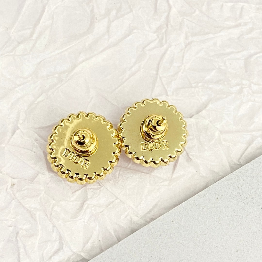 Dior pink button pearl stud earrings: Dior pink button pearl earrings. Round studs surround a pearl with a gold CD logo in the center. Exquisite, small, vintage, classic, elegant, and subtly feminine. A wonderful gift for you or your love