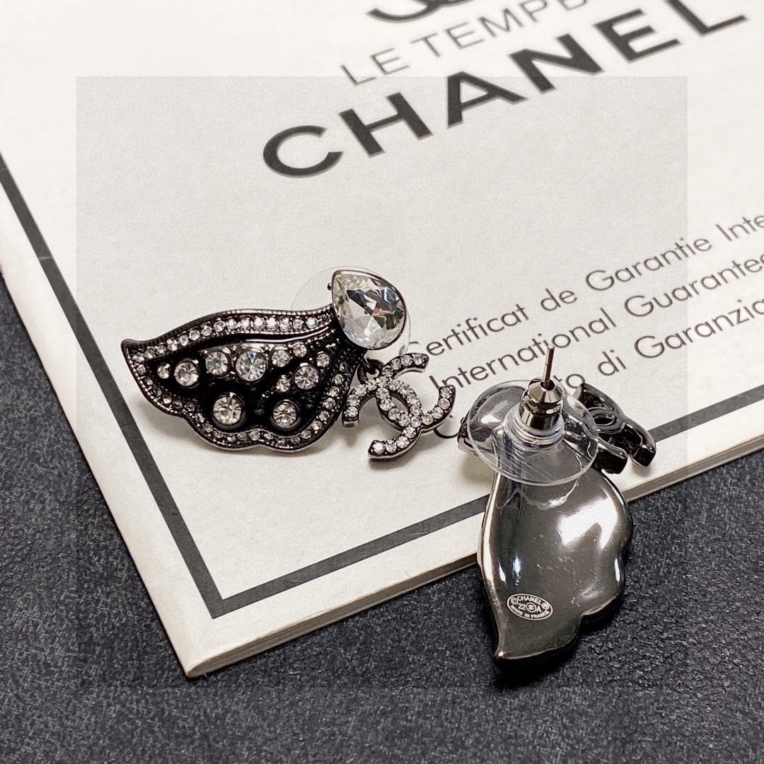 Chanel double C butterfly wing earrings: Chanel double C butterfly black wing earrings. A sophisticated, elegant, and intellectual statement piece. Vintage luxury without being overly complicated. The double C logo is classic and versatile, 