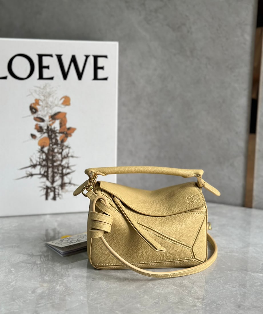 LOEWE: LOEWE Puzzle - A simple yet elegant geometric design with a lychee-patterned leather upper and cotton-linen lining. Mini size, large capacity, fits a phone, lipstick, or powder compact. Size: 18x11x7.