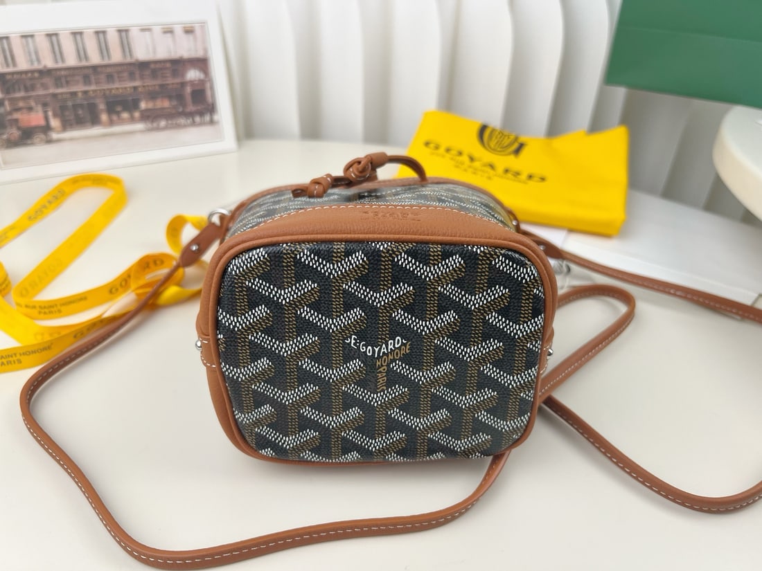Goyard Petit Flot: The Goyard Petit Flot mini bucket bag is incredibly tiny and adorable. It's stylish and sophisticated for a day out shopping. Not only can it be worn crossbody, but the shoulder strap is also detachab