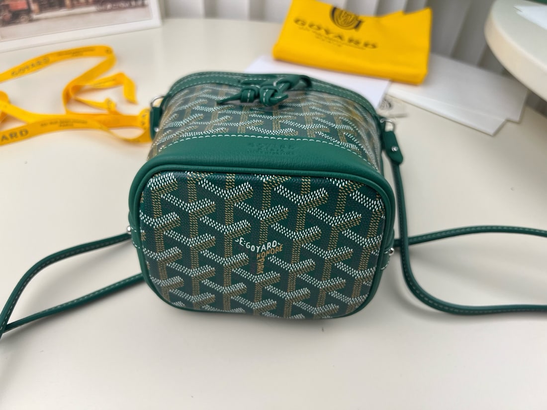 Goyard Petit Flot: The Goyard Petit Flot mini bucket bag is incredibly tiny and adorable. It's stylish and sophisticated for a day out shopping. Not only can it be worn crossbody, but the shoulder strap is also detachab