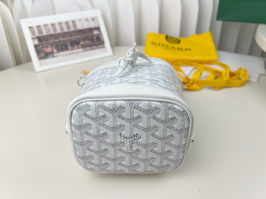 Goyard Petit Flot: The Goyard Petit Flot mini bucket bag is incredibly tiny and adorable. It's stylish and sophisticated for a day out shopping. Not only can it be worn crossbody, but the shoulder strap is also detachab