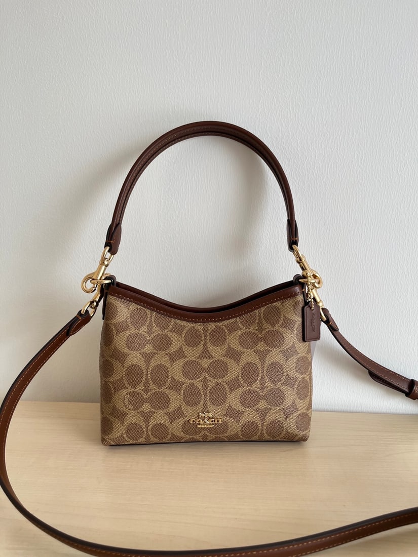 Coach Mini Laurel: Coach Mini Laurel Hobo Bag (Shoulder Crossbody Bag). It features the classic monogram canvas and top-grain cowhide leather, with two shoulder straps of varying lengths. It can be carried by hand, over