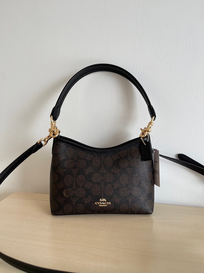 Coach Mini Laurel: Coach Mini Laurel Hobo Bag (Shoulder Crossbody Bag). It features the classic monogram canvas and top-grain cowhide leather, with two shoulder straps of varying lengths. It can be carried by hand, over