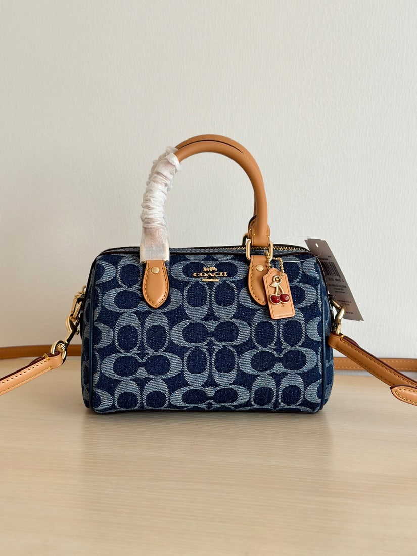 Coach MINI ROWAN: Coach MINI ROWAN Women's Shoulder Crossbody Handbag, Boston Bag, Denim Blue, High-Value Design. The leather patch and accessories make it increasingly adorable. Classic pillow bag shape, made of