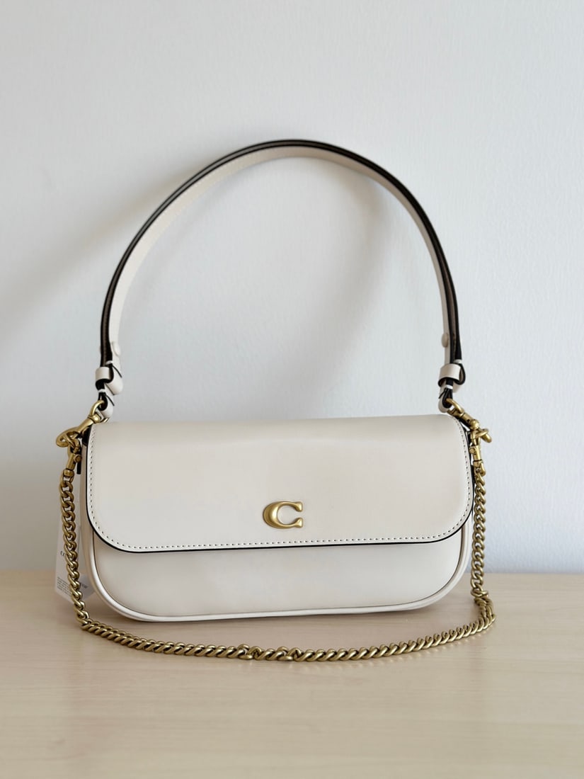 Coach: The Coach Brook baguette bag comes in two materials: cowhide and monogram canvas. It's incredibly lightweight and offers three carrying options to suit various styles. The double shoulder straps are