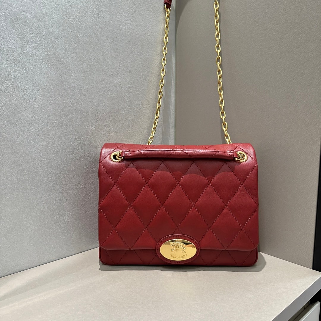 Burberry: Crafted from quilted calfskin, this bag features a uniquely crafted, supple surface. Its elegant design is adorned with a metal equestrian emblem, a motif inspired by iconic 1980s brand bags. It comes