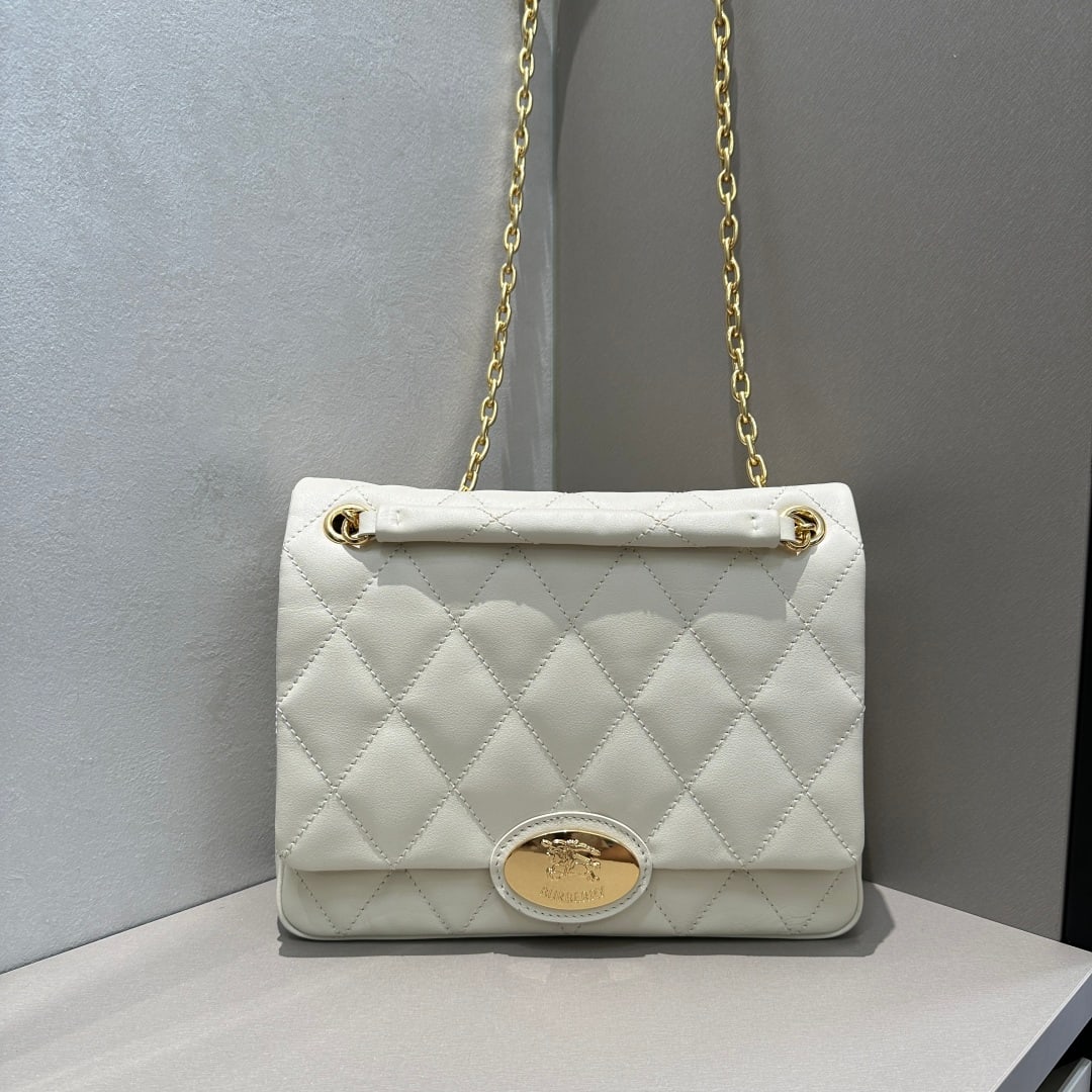 Burberry: Crafted from quilted calfskin, this bag features a uniquely crafted, supple surface. Its elegant design is adorned with a metal equestrian emblem, a motif inspired by iconic 1980s brand bags. It comes