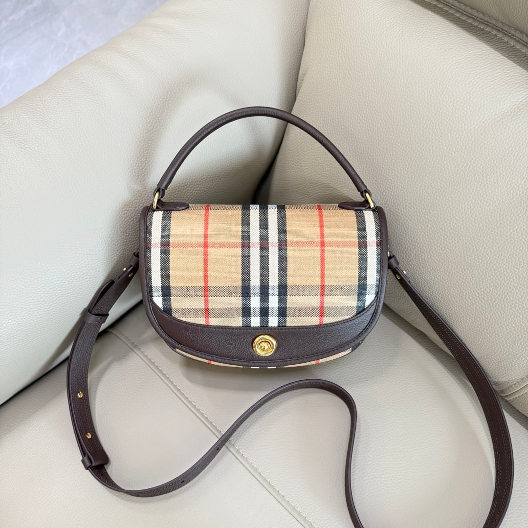 Burberry Highlands: The Highlands crossbody bag draws inspiration from outdoor design. Crafted in Italian workshops from a cotton-linen blend, it features smooth calfskin trim and a cotton lining. Adorned with a jacquard