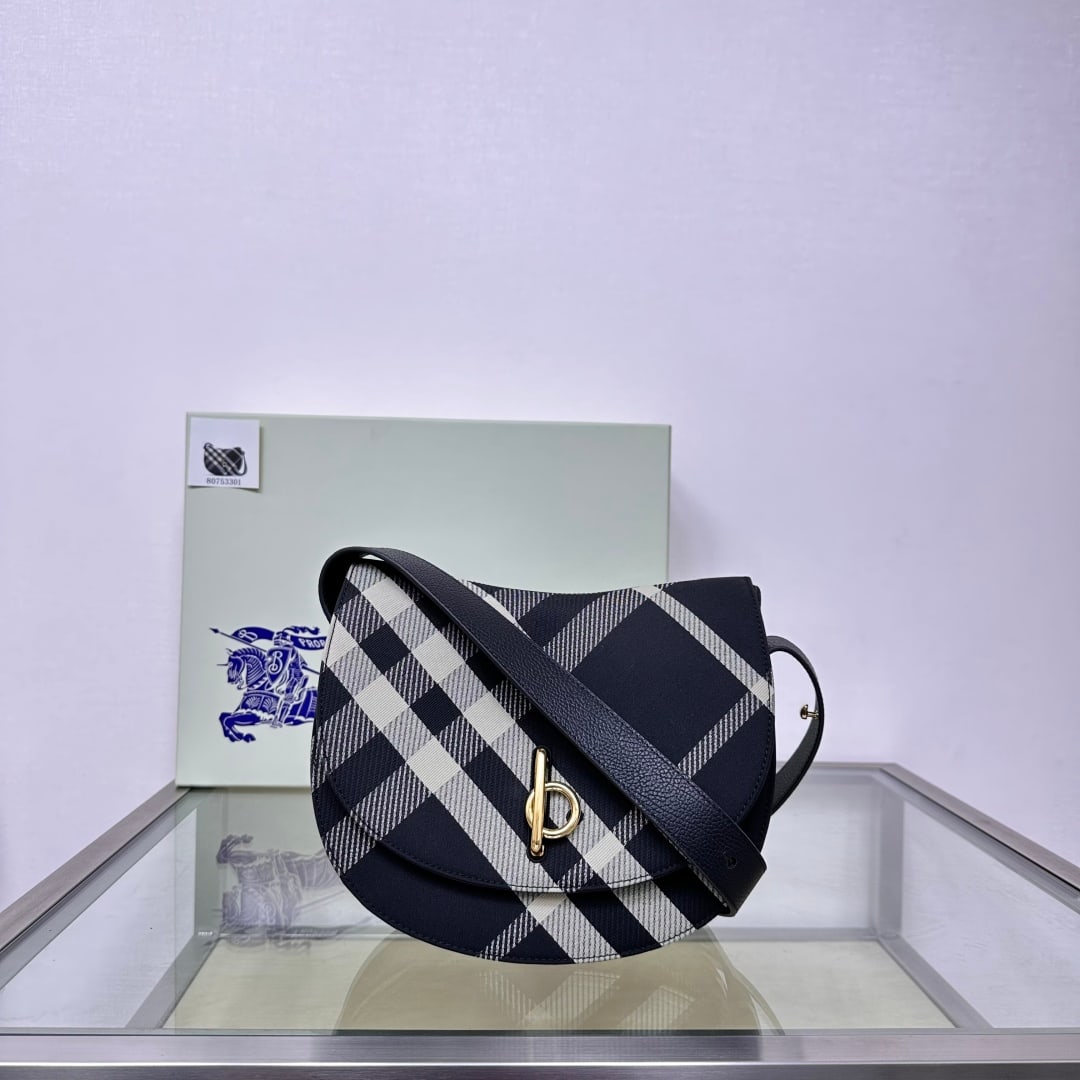 Burberry wool stand-up pouch: This Burberry wool stand bag is crafted in Italian workshops and adorned with the fine-woven Burberry check pattern. Its curved silhouette is inspired by the rocking horse of childhood, and features a