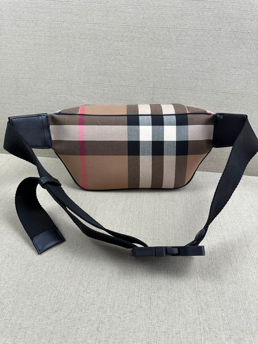 Burberry waist bag: The Burberry waist bag features a checkered pattern and is made of cowhide leather. It has a large capacity, enough to hold your essentials. The shoulder strap is adjustable, allowing it to be worn as