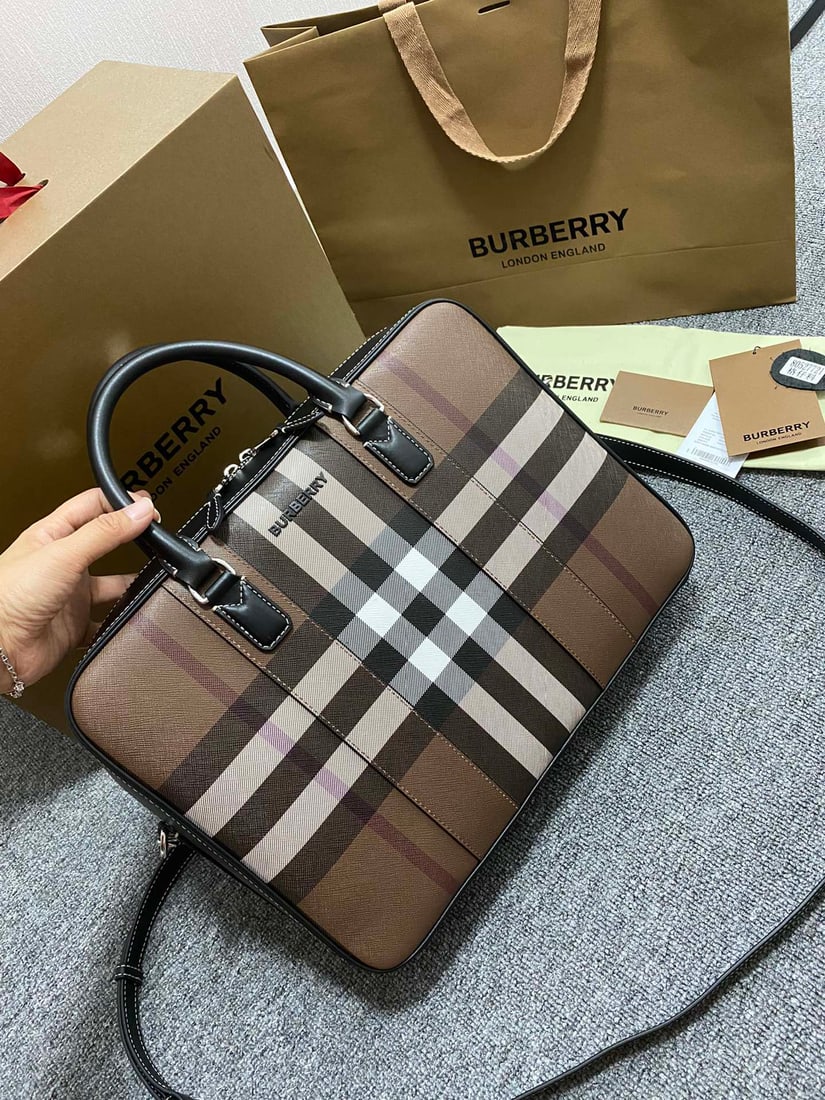 Burberry briefcase: This Burberry briefcase, crafted from checkered and Italian-tanned leather, is adorned with the brand's logo. It can be carried by hand or over the shoulder using the detachable strap. At least 30% of
