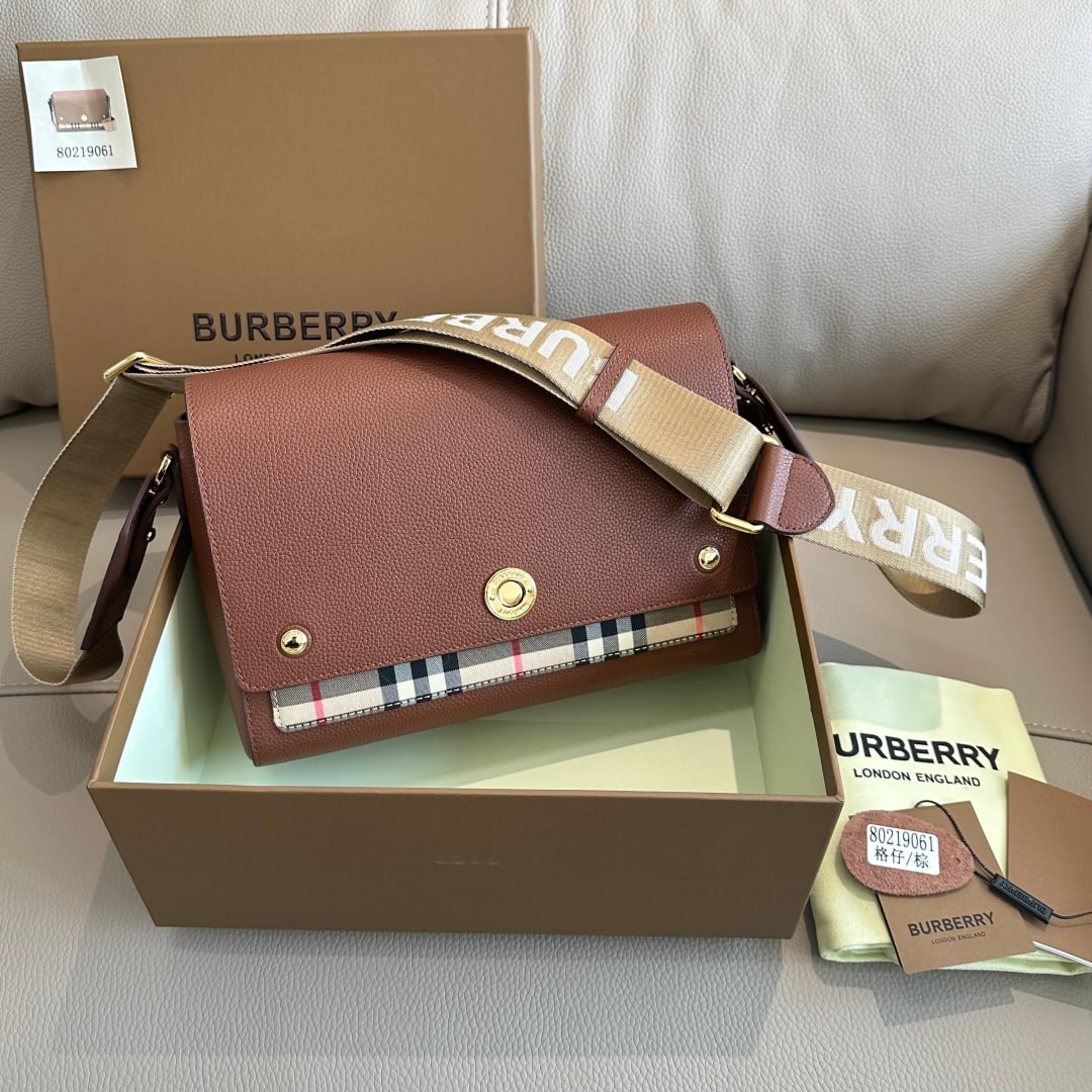 Burberry: This Burberry elegant crossbody bag features a wide shoulder strap with a distinctive logo, crafted from grained leather and a vintage check pattern. It includes an engraved snap closure and a detacha
