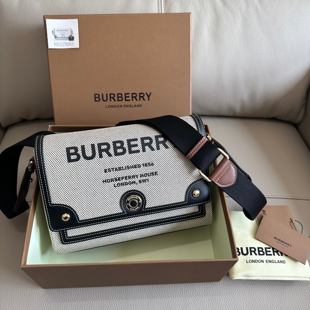 Burberry: This Burberry crossbody bag with a wide shoulder strap is crafted from calfskin and features a vintage check pattern, along with an engraved snap closure. It comes with a detachable shoulder strap ado