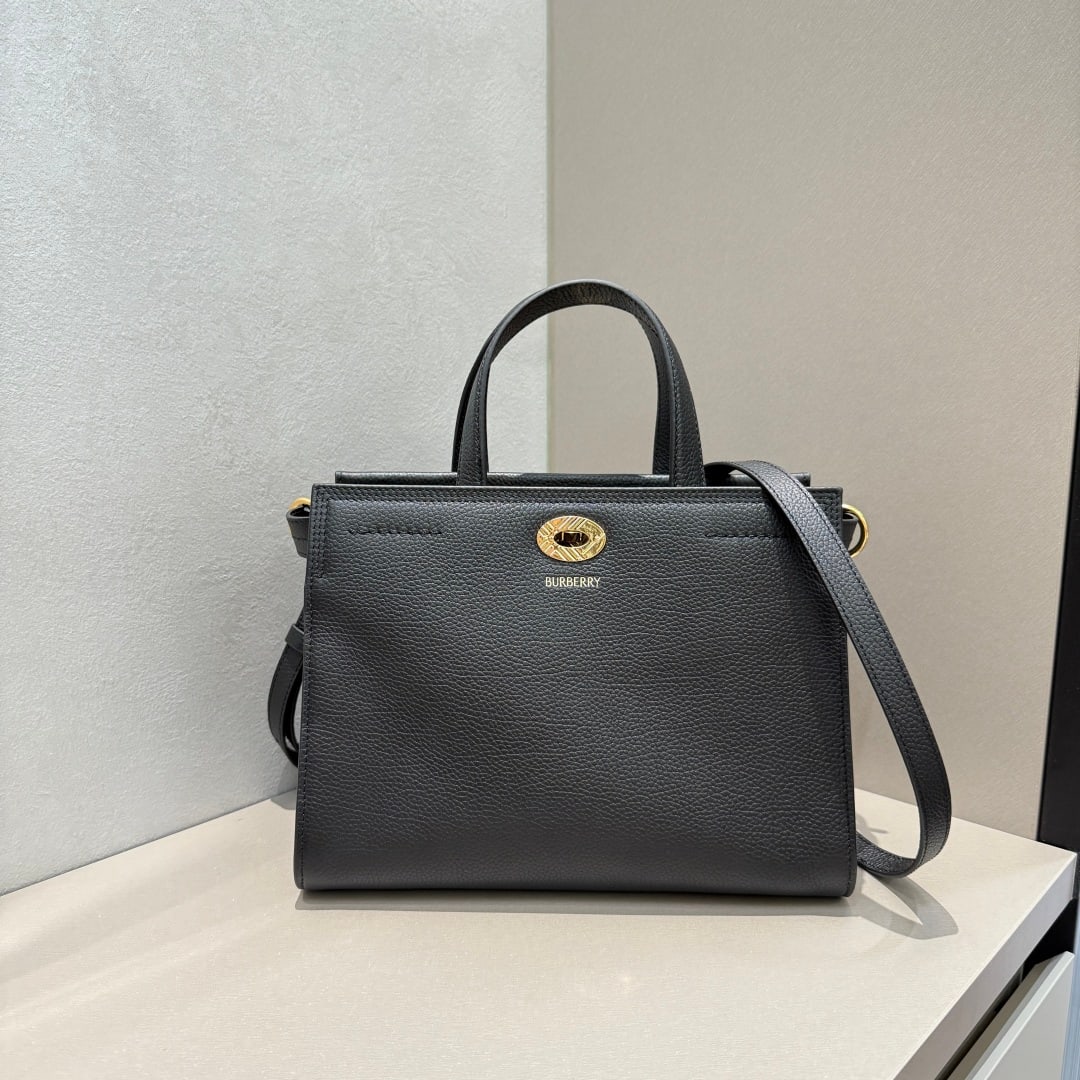 Burberry: This Burberry tote bag is crafted from Italian grained calfskin with a cotton-blend lining and finished in the iconic sand-colored Burberry check pattern. Its sophisticated design incorporates a check