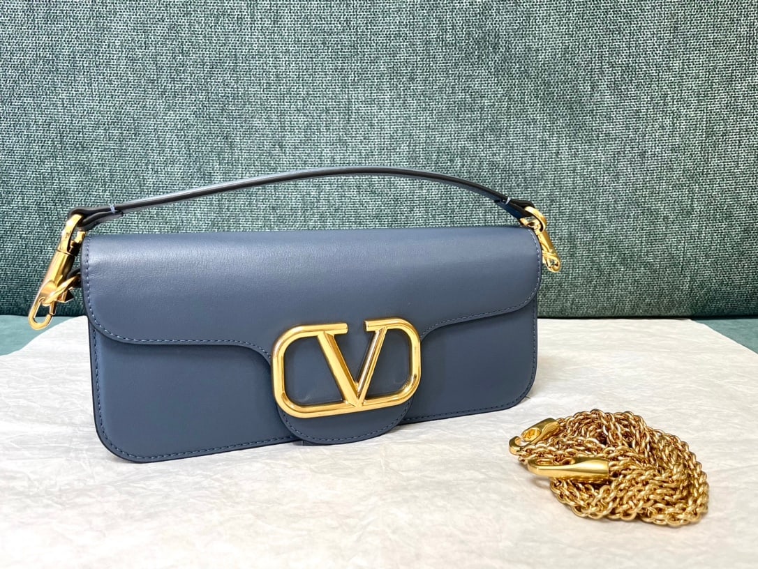 Valentino: Valentino calfskin handbag with metal V-logo Signacar trim - features detachable handles and a detachable sliding chain for shoulder, crossbody, or hand carrying. Vintage brass distressed finish hardw