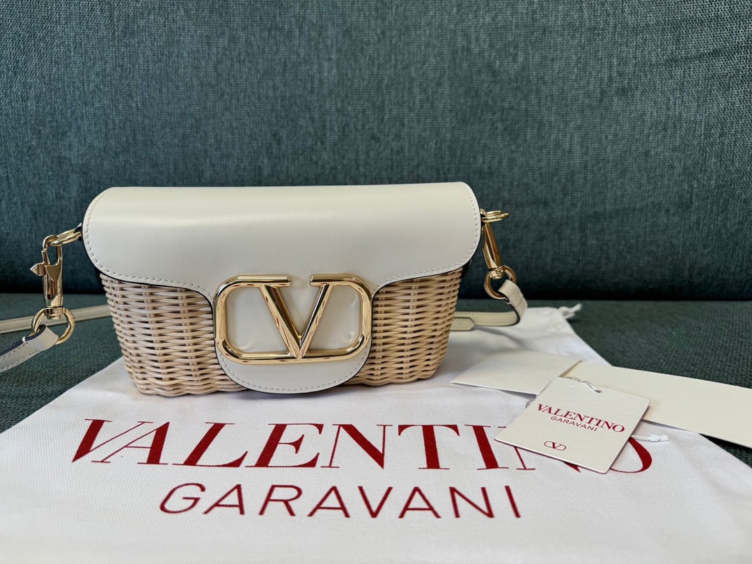 Valentino: White 24 Summer Valentino Bamboo Woven Small Crossbody Bag, original cowhide leather with suede lining, one slip pocket with ample capacity. Shoulder strap length 150cm, adjustable. Dimensions: 21.5x1