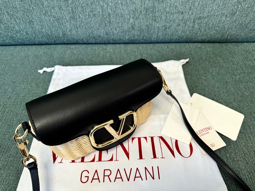 Valentino: Black 24 Summer Valentino Bamboo Woven Small Crossbody Bag, original cowhide leather with suede lining, one slip pocket with ample capacity. Shoulder strap length 150cm, adjustable. Dimensions: 21.5x1