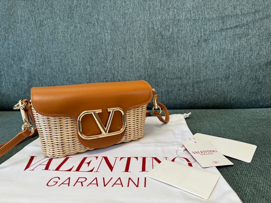 Valentino: Brown 24 Summer Valentino Bamboo Woven Small Crossbody Bag, original cowhide leather with suede lining, one slip pocket with ample capacity. Shoulder strap length 150cm, adjustable. Dimensions: 21.5x1