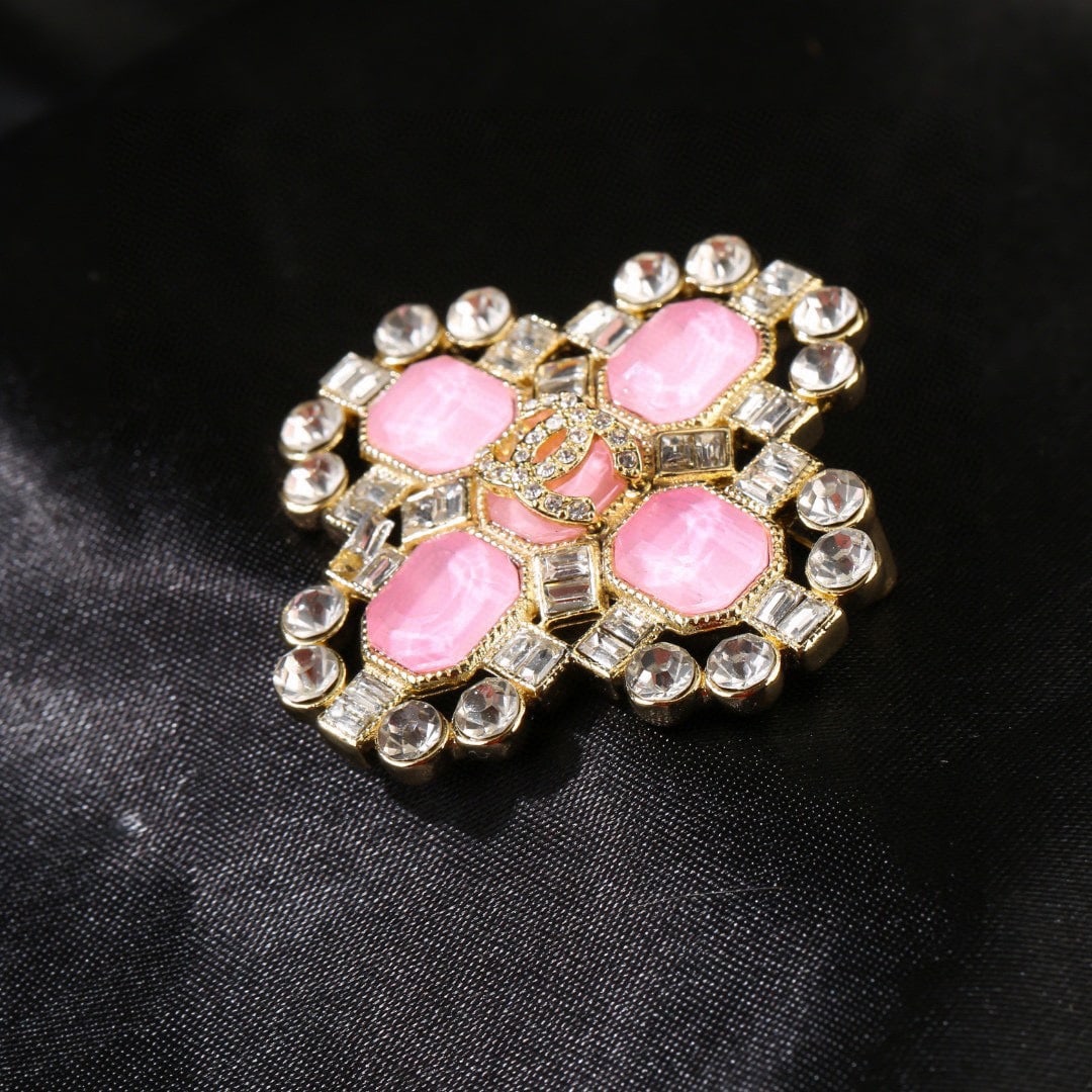 Chanel pink diamond brooch: This Chanel pink diamond brooch is exquisitely detailed; the design is absolutely stunning. It's truly gorgeous, ethereal, and a must-have for any sophisticated young woman. A wonderful gift for you o