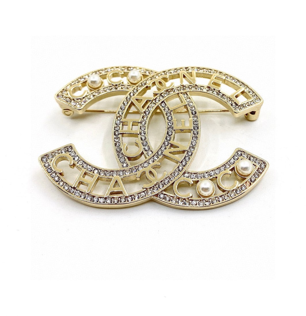 Large New Letter Pearl Openwork Diamond Brooch CHANEL: Large, new CHANEL letter pearl openwork diamond brooch. Exquisite and delicate, a super fairy-like and beautiful gift for you or your loved one. We offer consoiled shipment for all goods to our