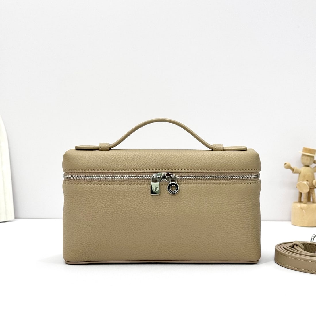 Loropiana Extra Pocket L19 Clutch: Loropiana Extra Pocket L19, light frankincense color with silver hardware. This is a functional clutch with a wide opening, combining classic style and minimalist design. The bag is made of calfskin w