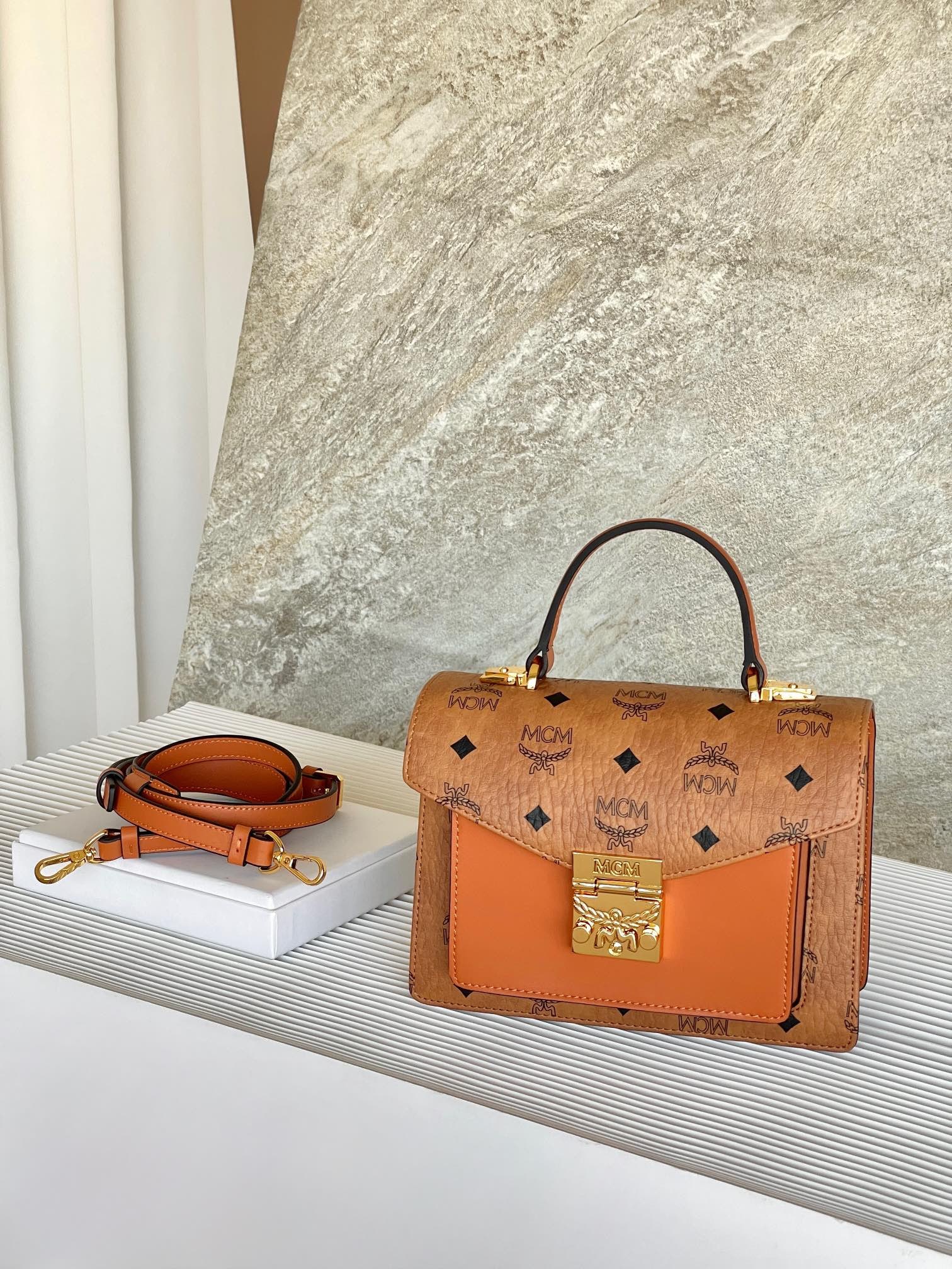 MCM Tracy Satchel Handbag Crossbody Accordion Bag: MCM Tracy Satchel Handbag Crossbody Bag in Classic Cognac Color. This classic crossbody bag is a sophisticated accessory that adds elegance to your look. Crafted from classic Visetos material, its des