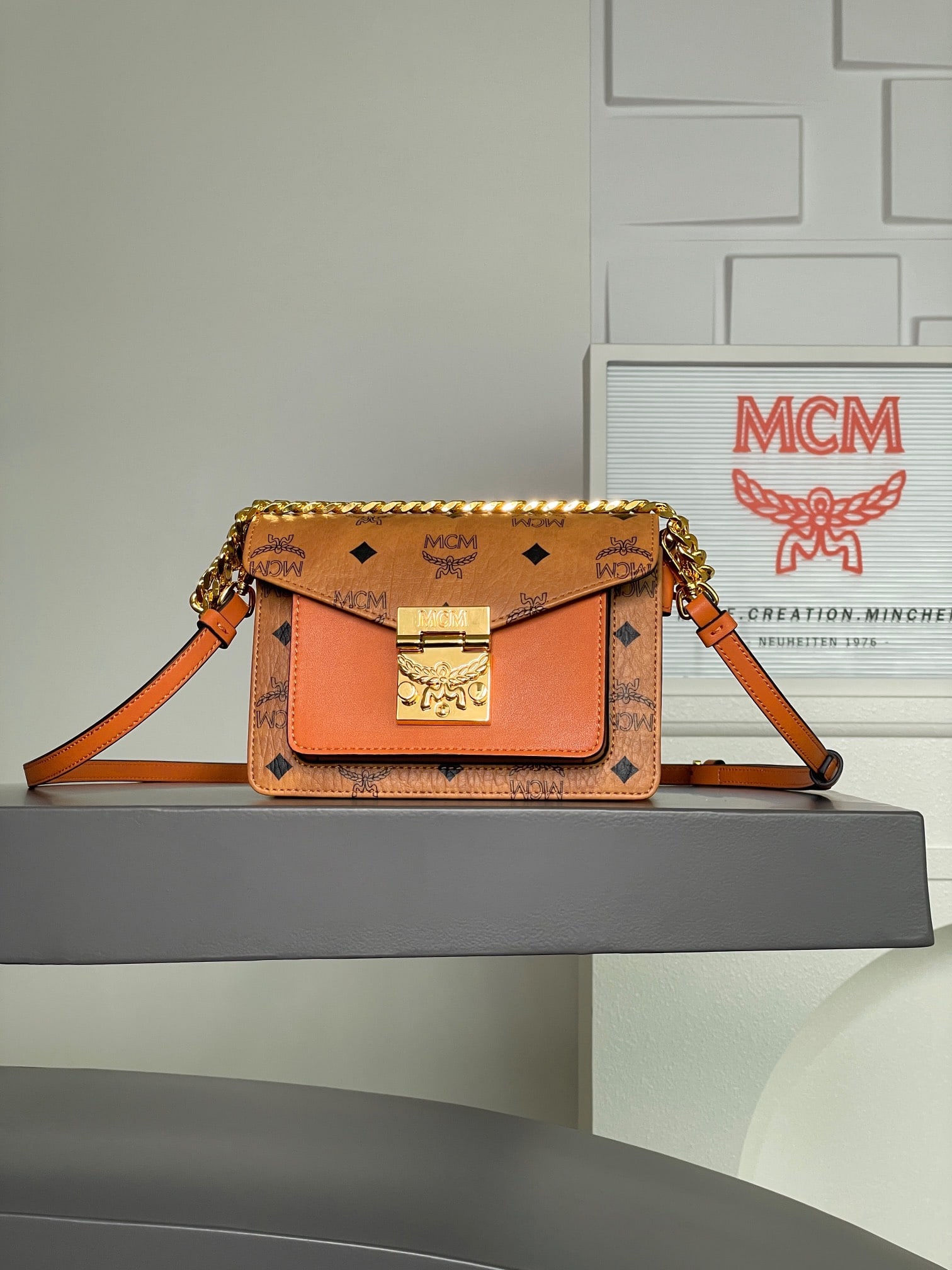MCM Tracy Satchel Mini Daphne Accordion Bag: The MCM Tracy Satchel mini Daphne accordion bag features an elegant design in classic cognac. Made from classic Visetos material with Spanish Nappa leather trim, this stylish mini Tracy crossbody bag 