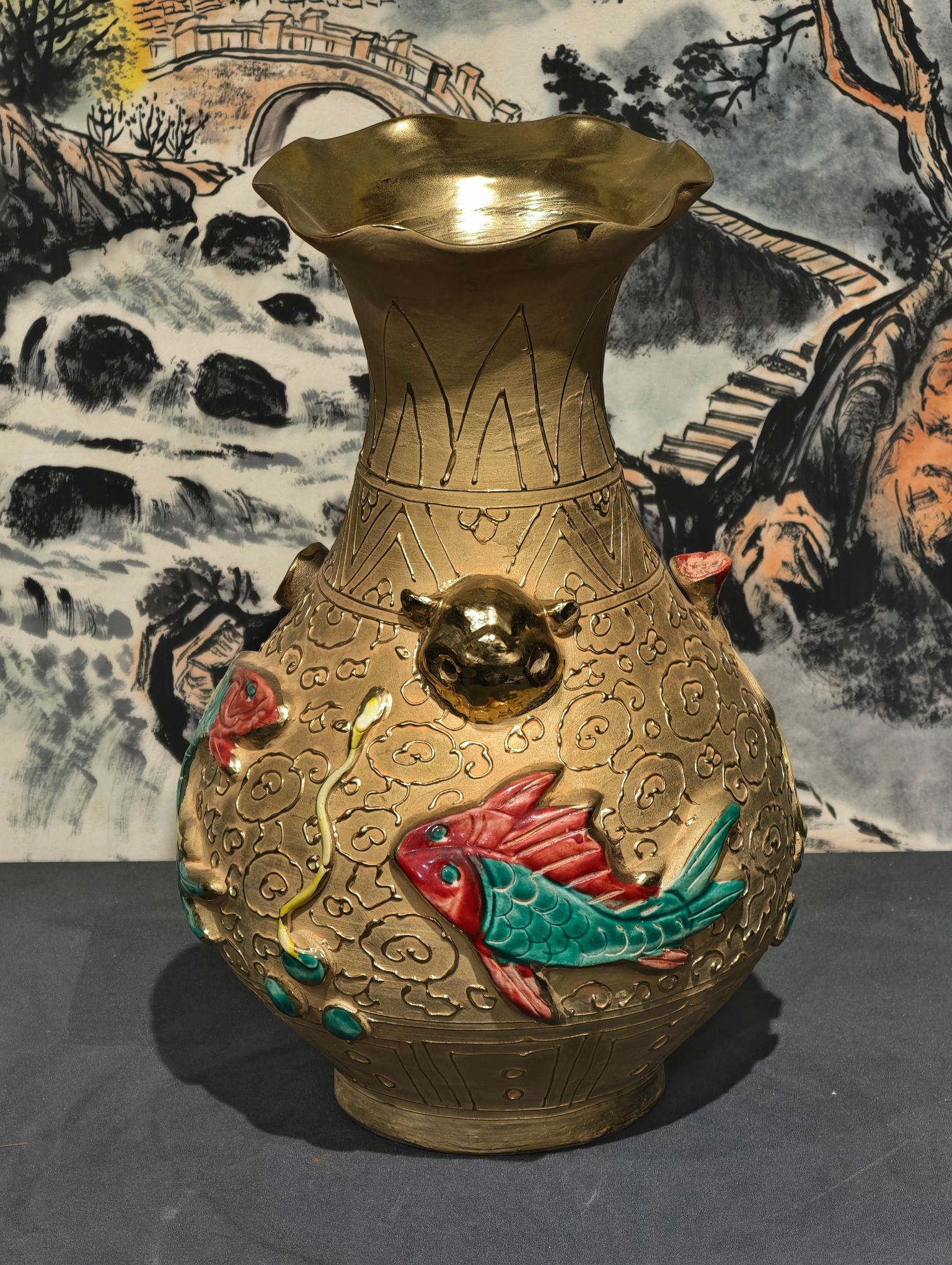 Formerly in the collection, marked "Baihu Guyao" carved porcelain gilt red and green enamel duster: A porcelain duster-shaped vase with carved and painted red and green decoration, bearing the mark "Baihu Guyao" (?????), measuring 29.5 cm in height and 20 cm in width. Provenance:Private collection f