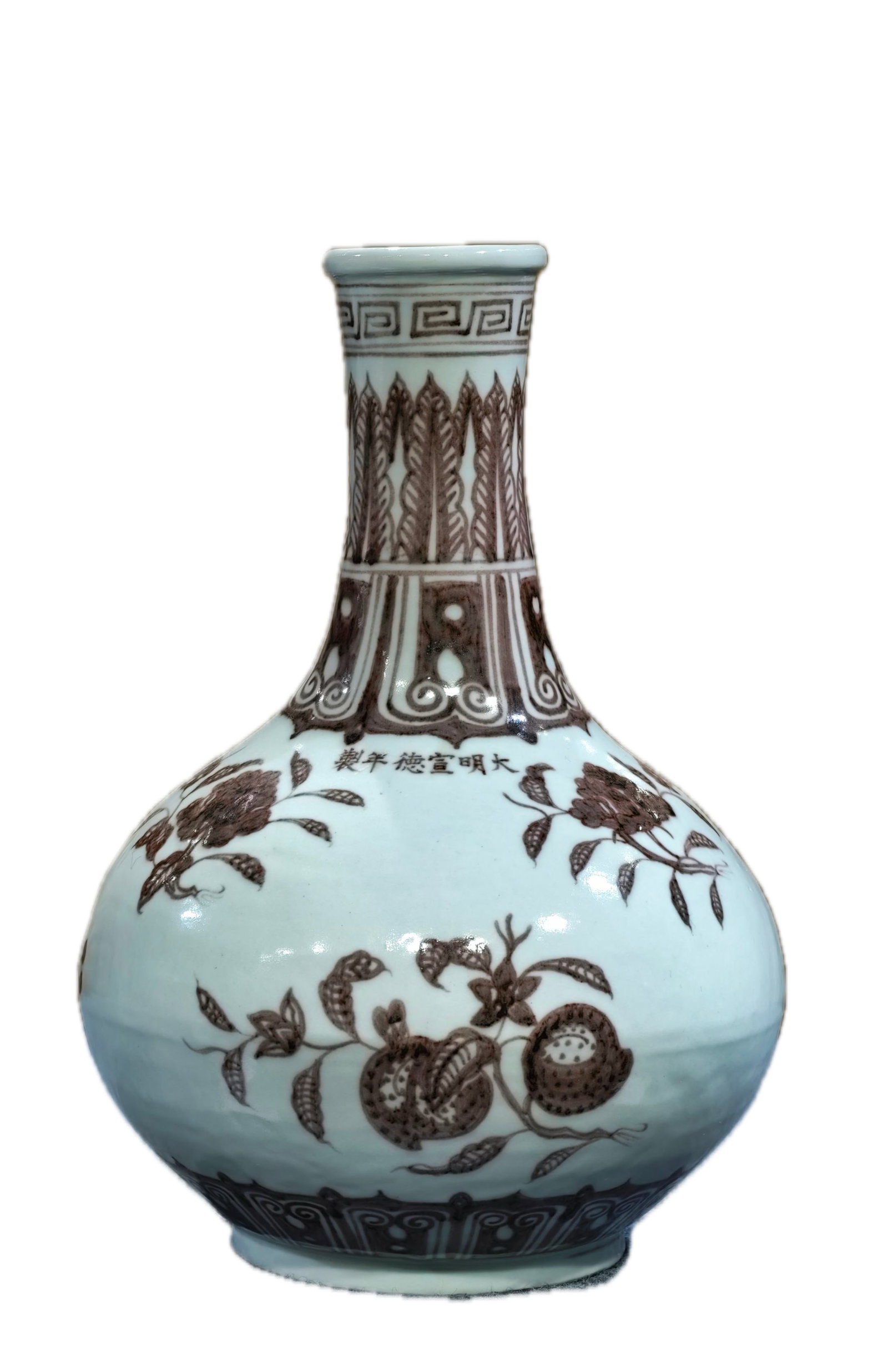 A formerly owned underglaze red three-fruit pattern duster vase with the mark "Made in the Xuande (1 of 11)