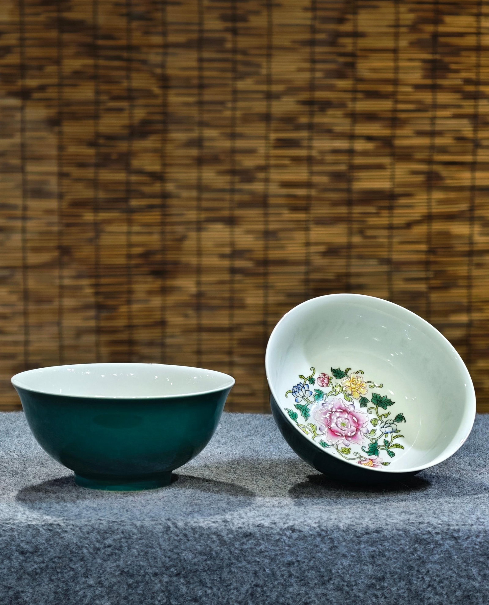 A pair of monochrome olive-green bowls with lotus scroll design painted inside, formerly in the: A pair of monochrome olive-green bowls with a lotus scroll design painted inside, formerly in the collection and bearing the mark "Made in the Yongzheng Reign". 7.5 cm high, 15 cm wide. Provenance:Pri